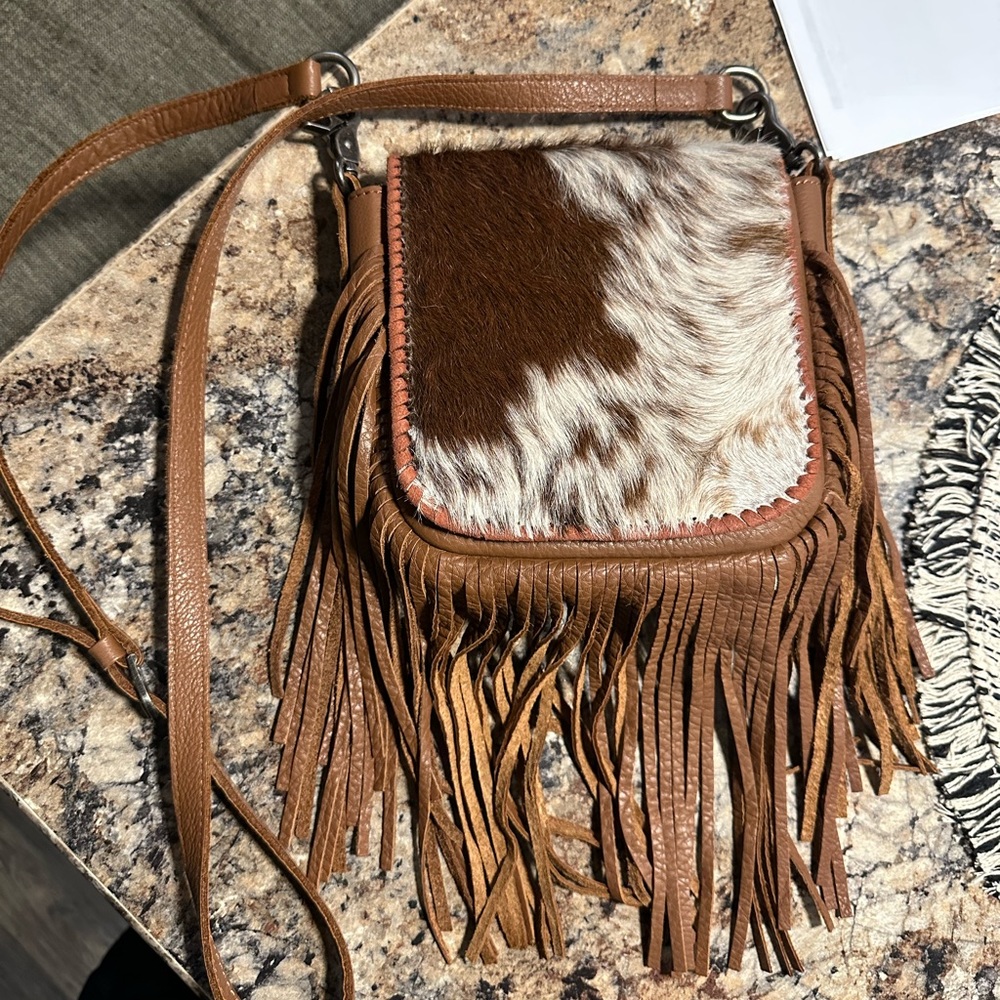 Cowhide fringe purse